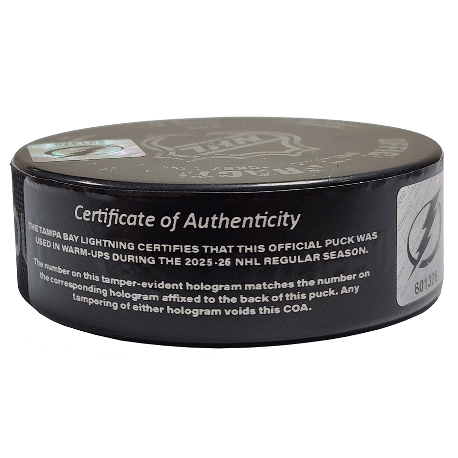 Hockey puck with Certificate of Authenticity text on a white background