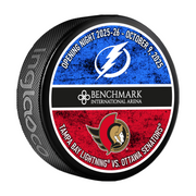 Hockey puck with Tampa Bay Lightning and Ottawa Senators logos and event details.