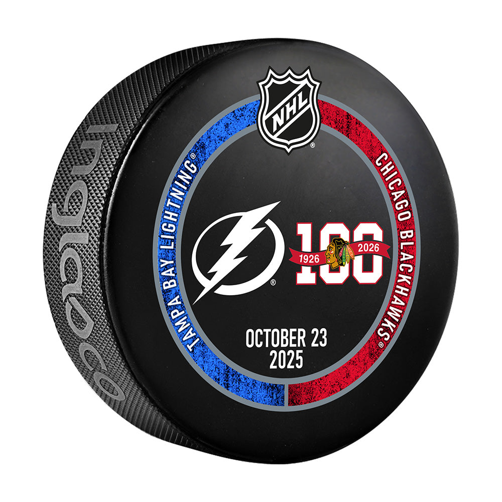 Hockey puck with NHL logo and Tampa Bay Lightning and Chicago Blackhawks branding