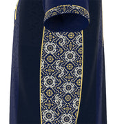 A close-up of a dark navy blue garment, likely a robe or vestment, featuring an ornate vertical panel with a white and gold geometric floral pattern and a matching patterned cuff.